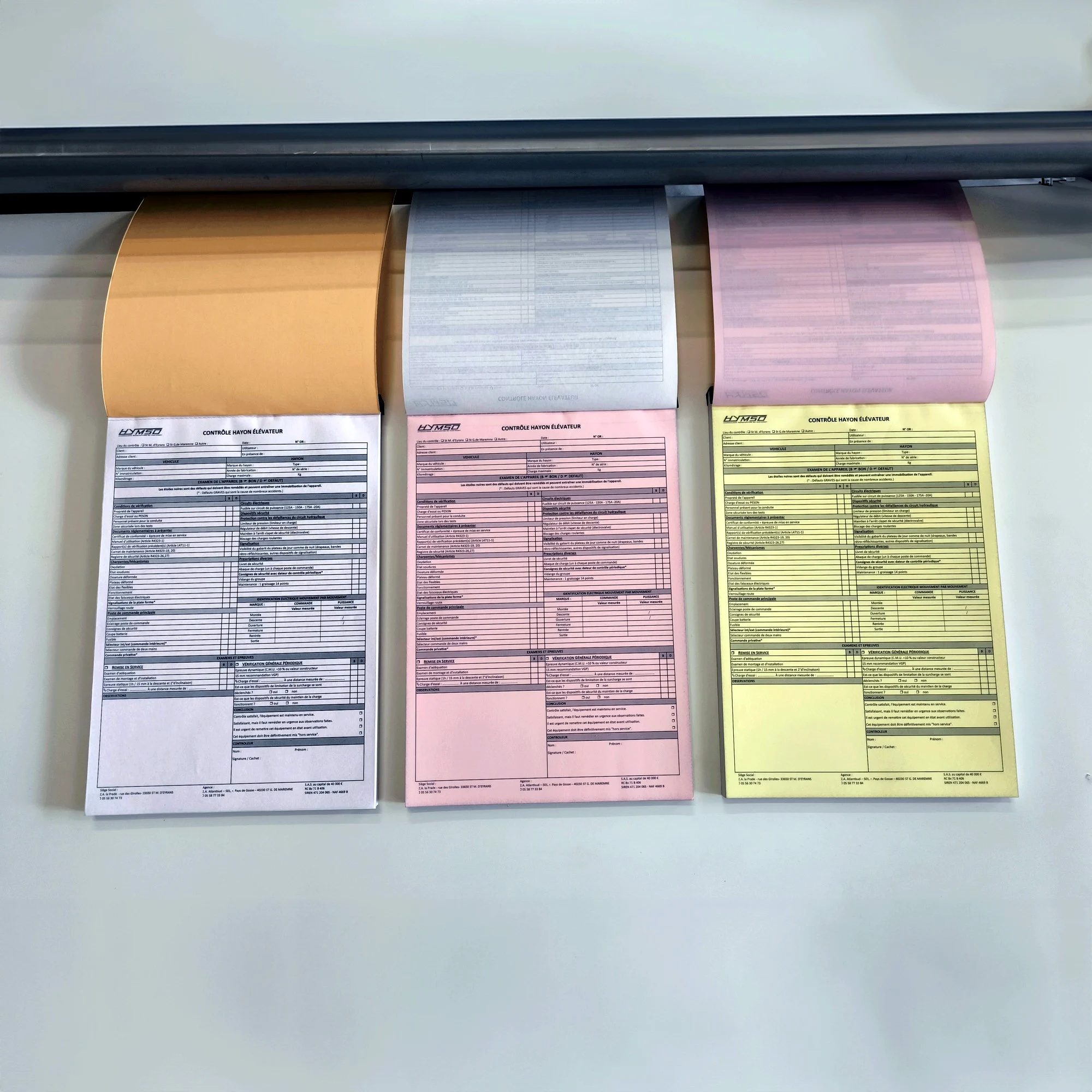 Carnets autocopiants Hymso en trois feuillets blanc, rose et jaune pour le contrôle de hayon élévateur