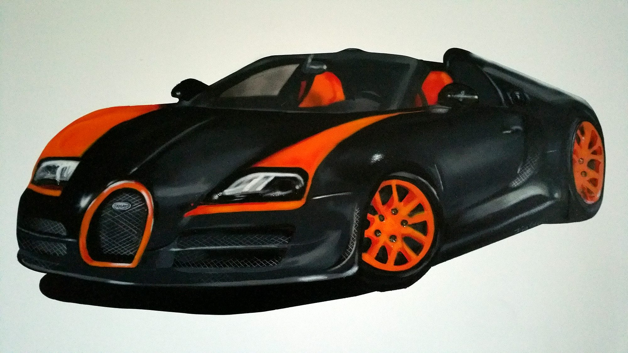 Voiture de sport décapotable noire et orange peinte à la bombe sur le mur d’une chambre d’enfant